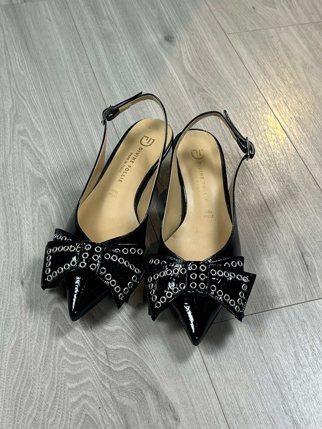Black Slingback Vernice shoes with 3 cm heel and studded bow detail