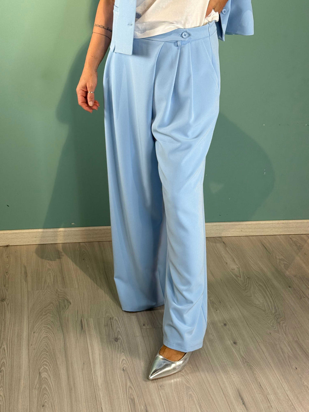 Light blue Pantalone Spring Saiph palazzo pants with regular fit on model.