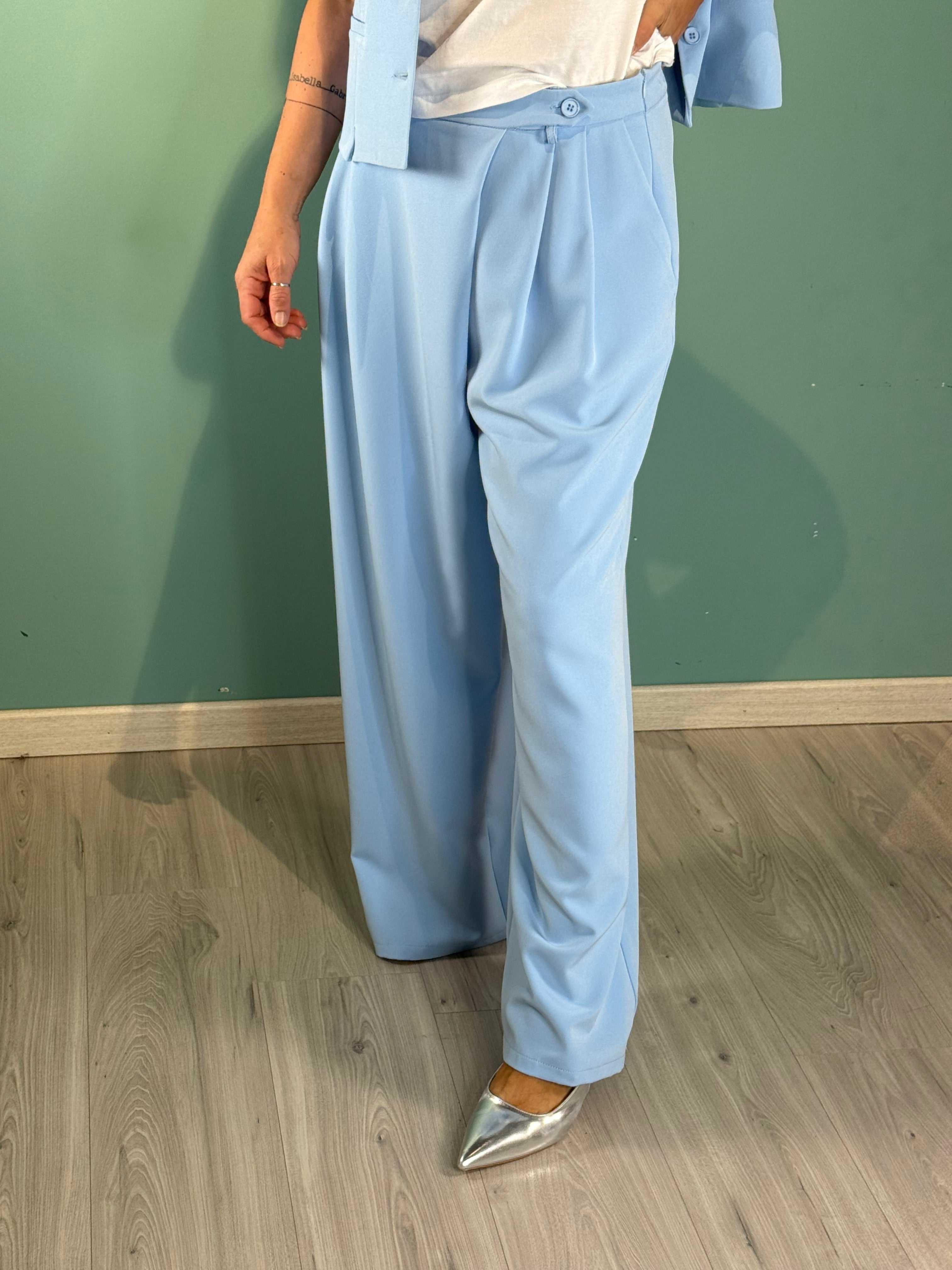 Light blue Pantalone Spring Saiph palazzo pants with regular fit on model.