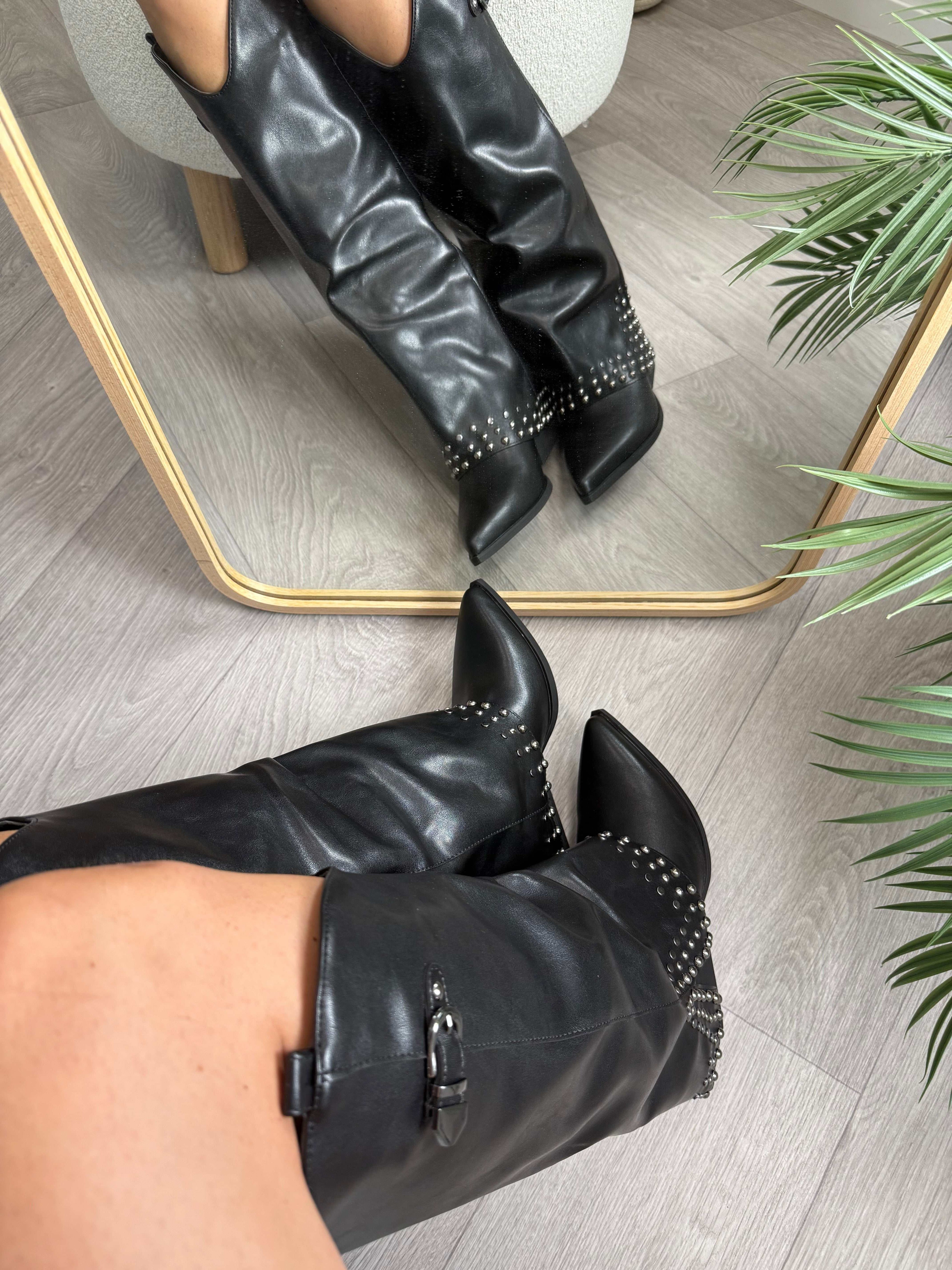 Black Texano Borchie Nero high boots with 5cm heels and stud detailing reflected in mirror on wooden floor