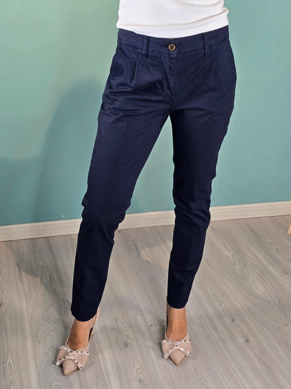 Pantalone Rio Squad navy cigarette fit trousers in cotton and elastane blend modeled on woman standing on wood floor