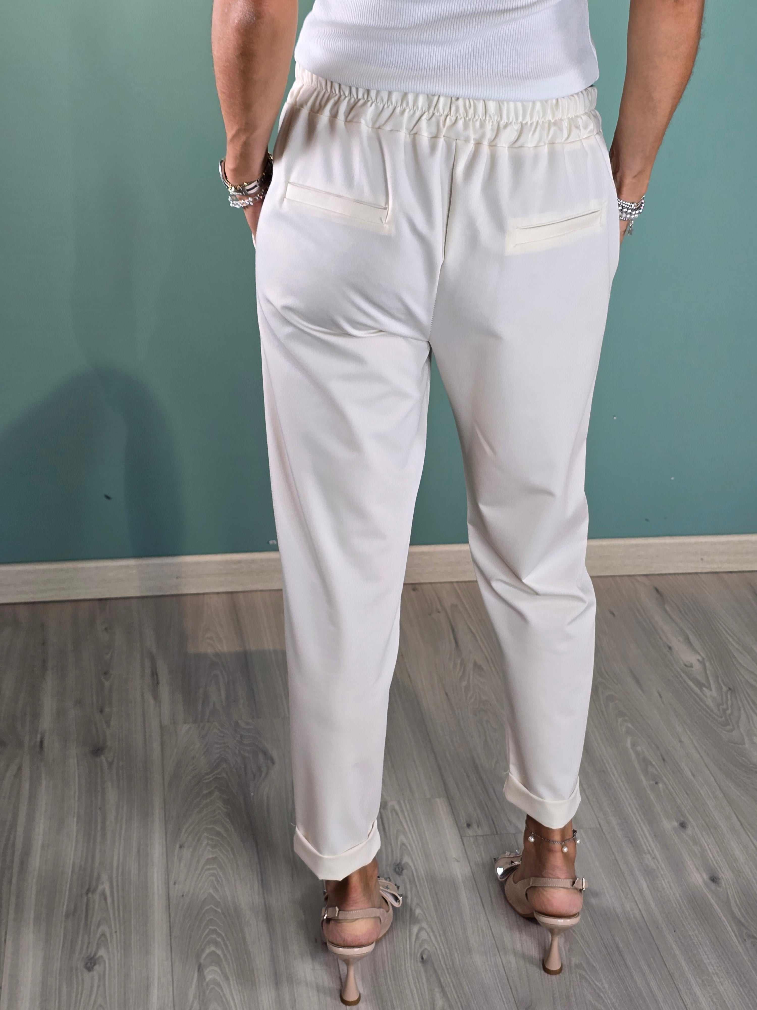 Back view of woman wearing white Pantalone Moody chinos with elastic waistband and regular fit