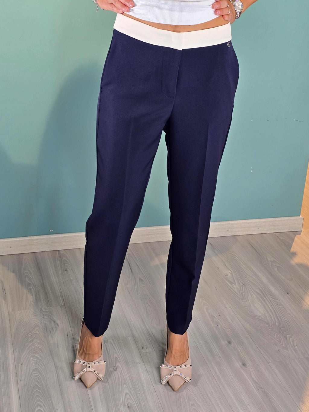 Pantalone Cream Please navy cigarette pants with butter waistband and regular fit on model.